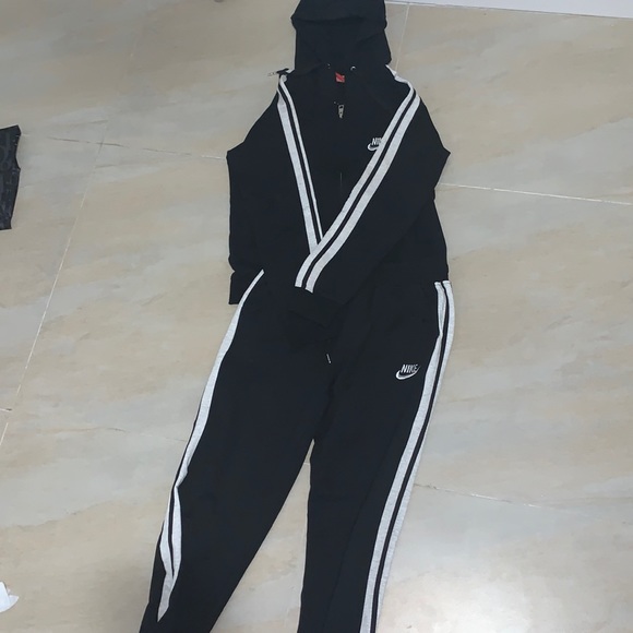 a sweater from nike and sweat pants from nike